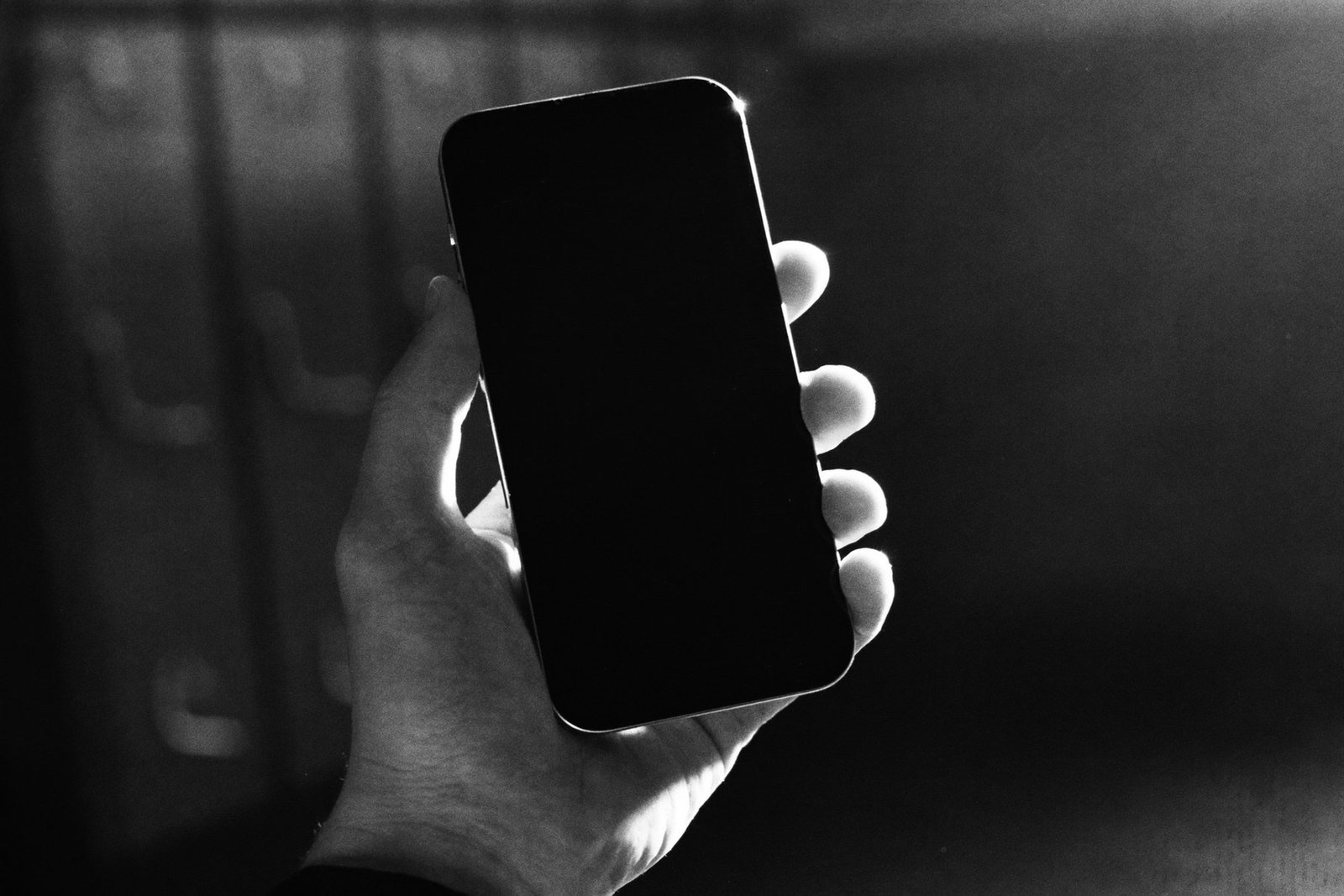 A phone held in a dark locker room